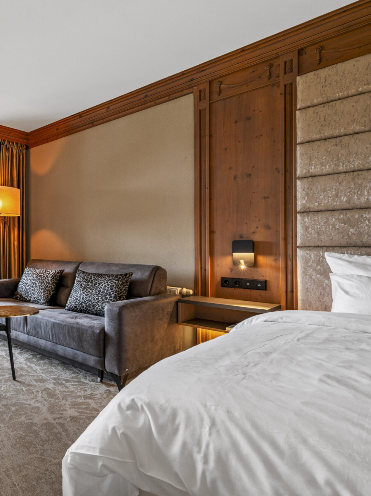 Modern hotel room with balcony and sofa