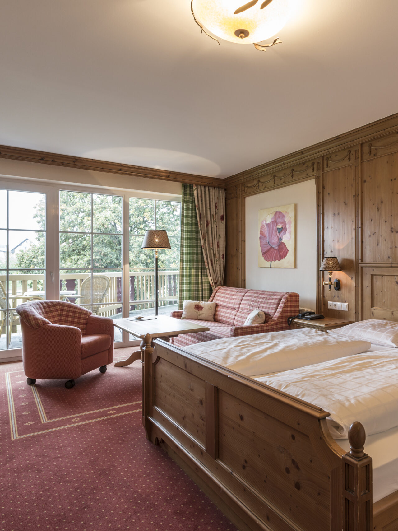 Cozy comfort room in country house style with balcony and garden view