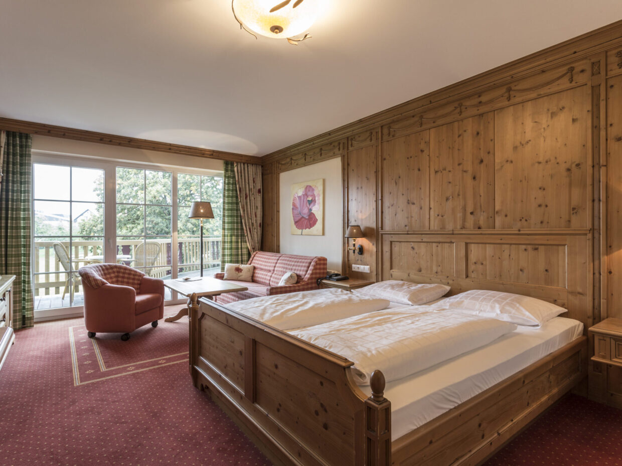 Cozy comfort room in country house style with balcony and garden view