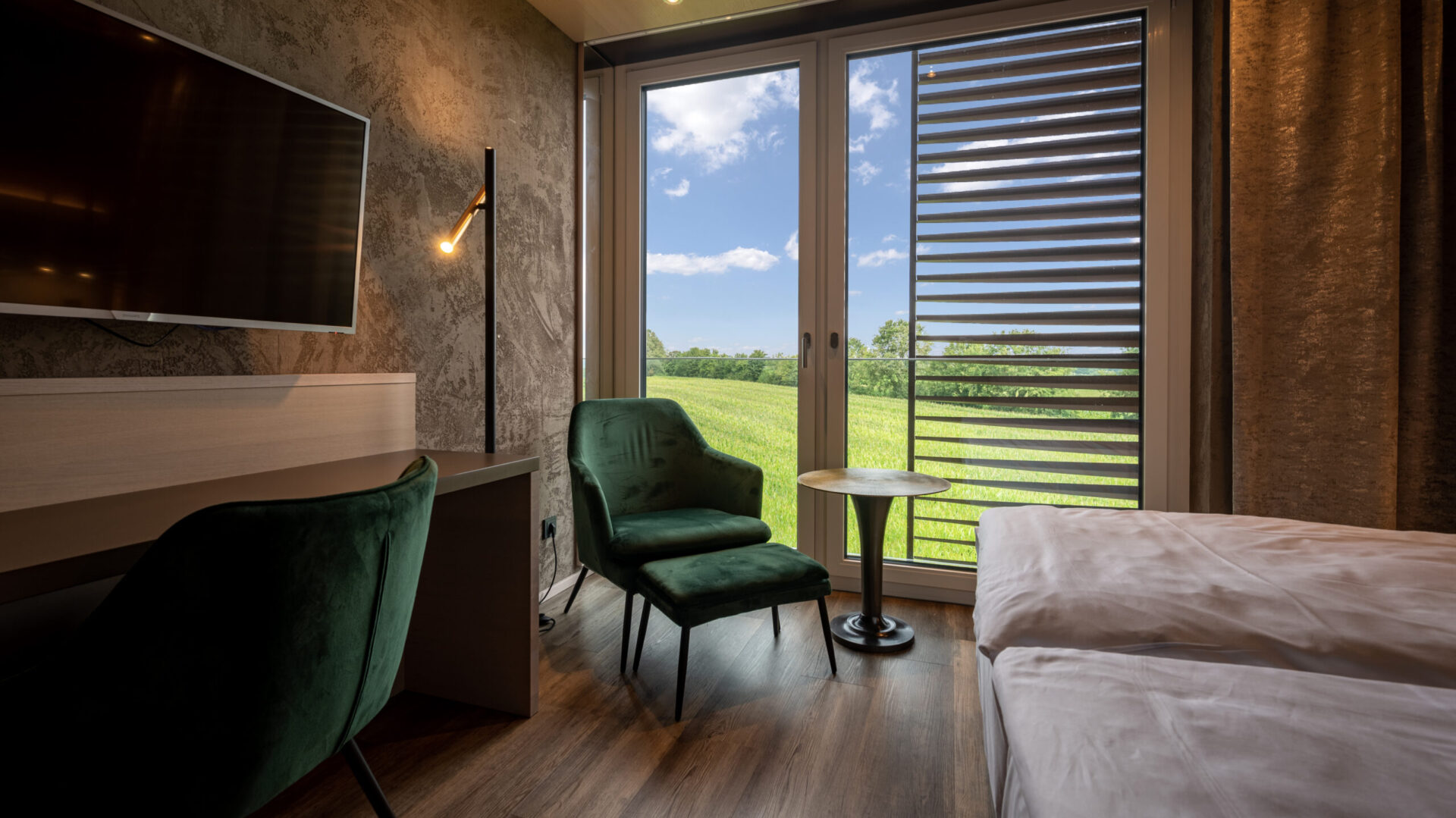 Modern hotel room with a view of the countryside through the window