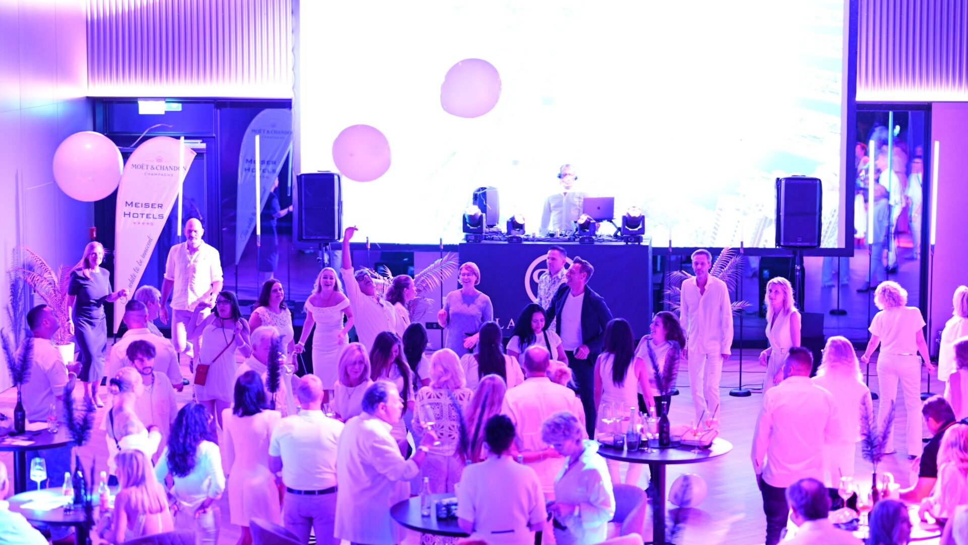 People at party in white clothes, dance floor, DJ
