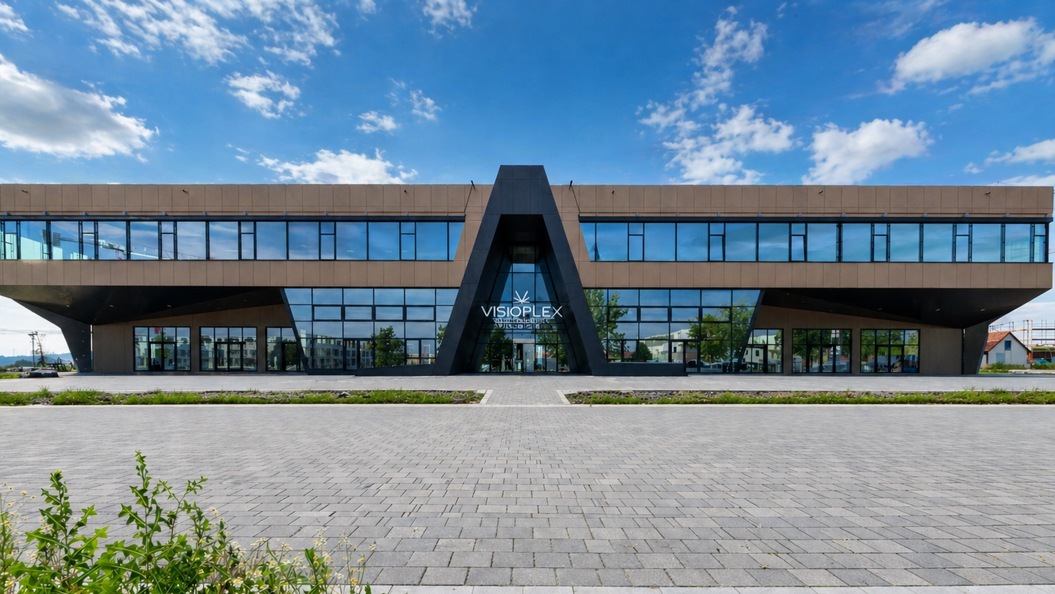 Modernes Gebäude mit Glasfassade und Beton.